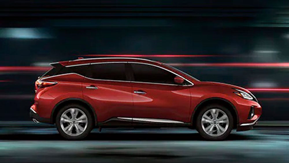 2023 Nissan Murano shown in profile driving down a street at night illustrating performance. | Courtesy Nissan PA in Altoona PA