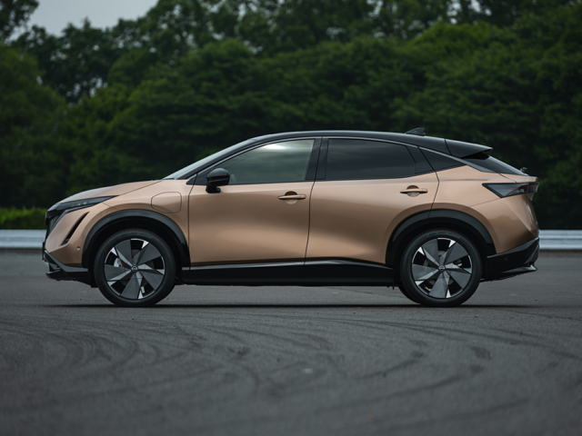 Profile view of a gold 2023 Nissan Ariya. | Nissan dealer in Altoona, PA | Courtesy Nissan PA
