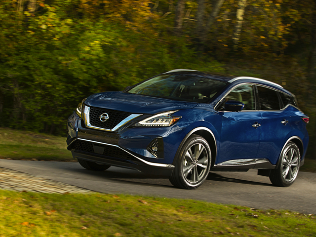 A blue 2024 Nissan Murano being driven on the road with trees in the background. | Nissan Dealer in Altoona, PA | Courtesy Nissan PA